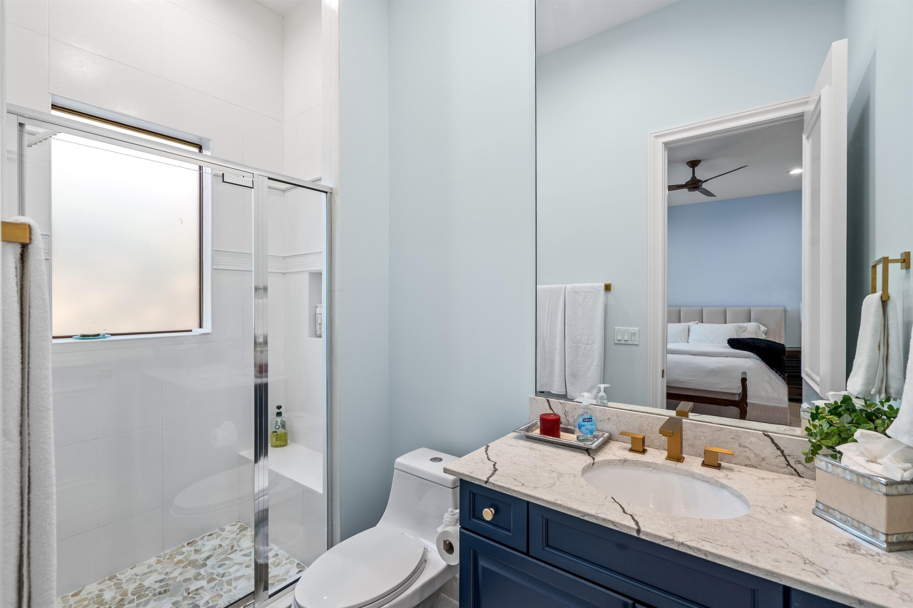 17894 Monte Vista Drive Boca Raton, FL 33496 - Photo 21 of 47 a bathroom with a sink toilet vanity and tub