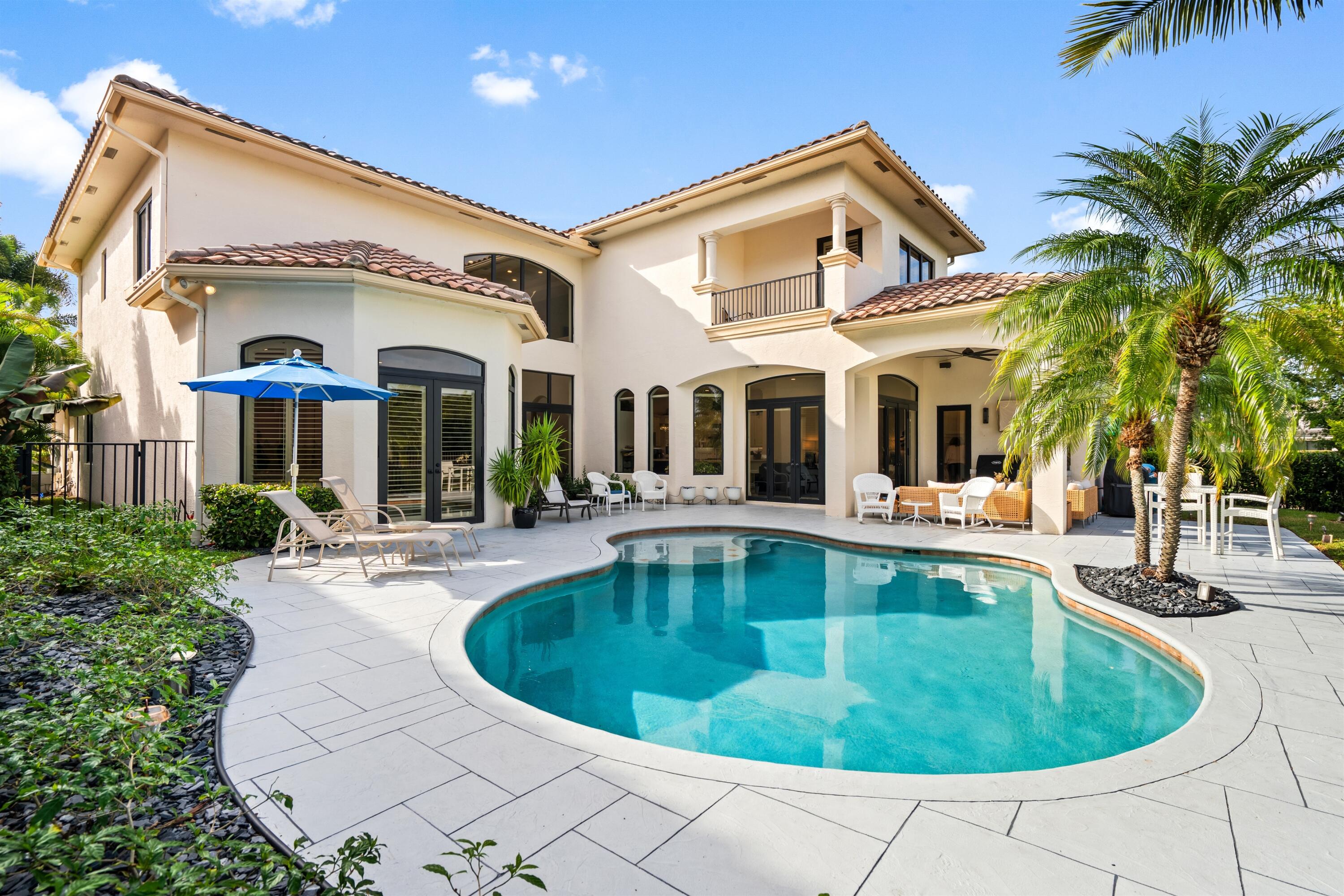 17894 Monte Vista Drive Boca Raton, FL 33496 - Photo 27 of 47 a view of a house with swimming pool and sitting area