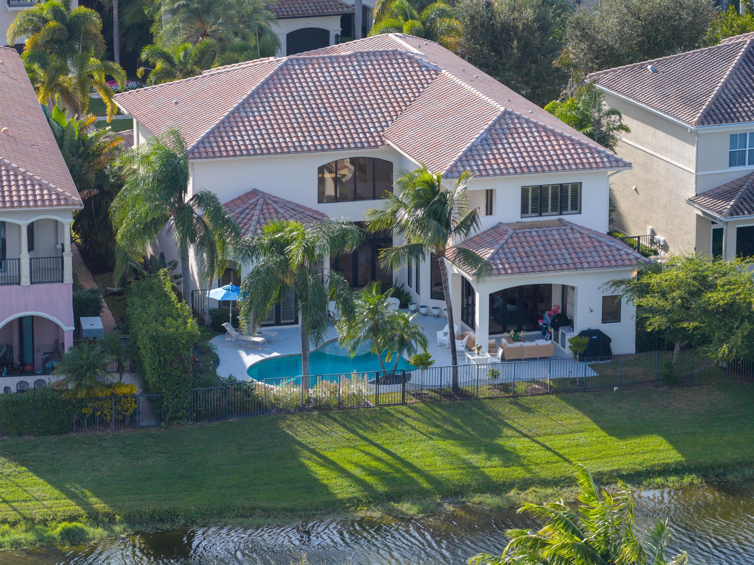 17894 Monte Vista Drive Boca Raton, FL 33496 - Photo 30 of 47 a front view of a house with garden