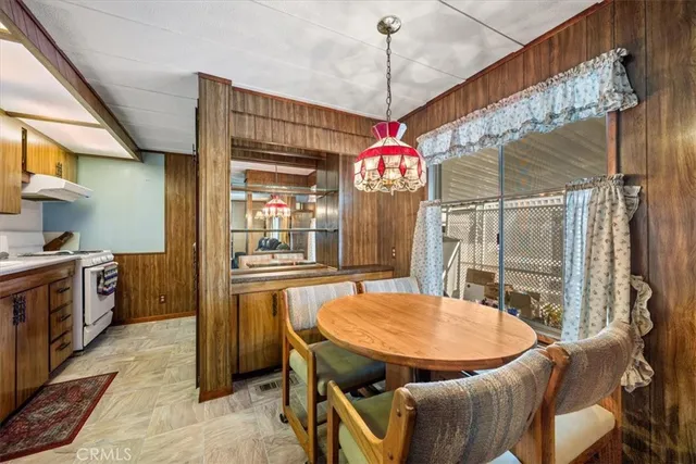 a kitchen with stainless steel appliances a sink and a refrigerator