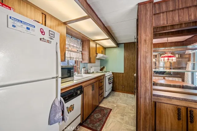 a kitchen with a sink and a refrigerator