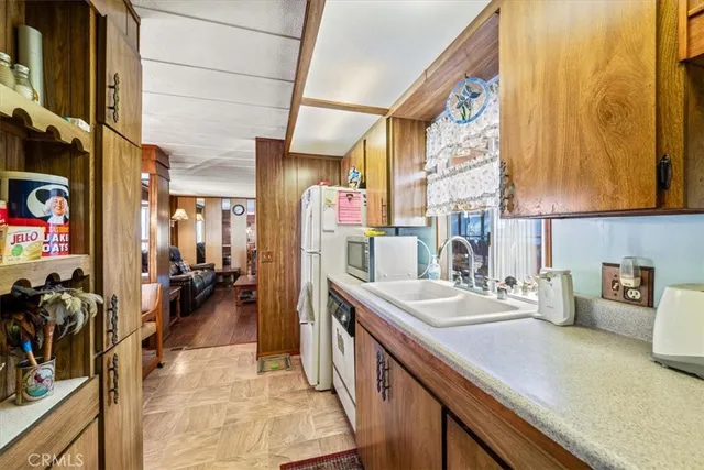 a bedroom with a bed and large window with outer view