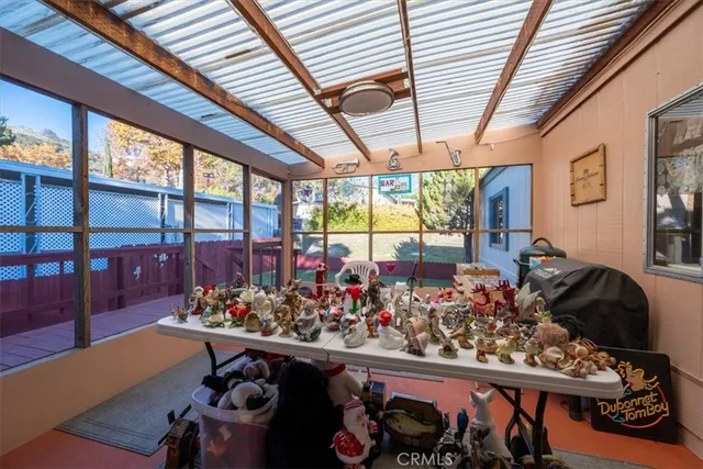 a living room with furniture a wooden floor and a window