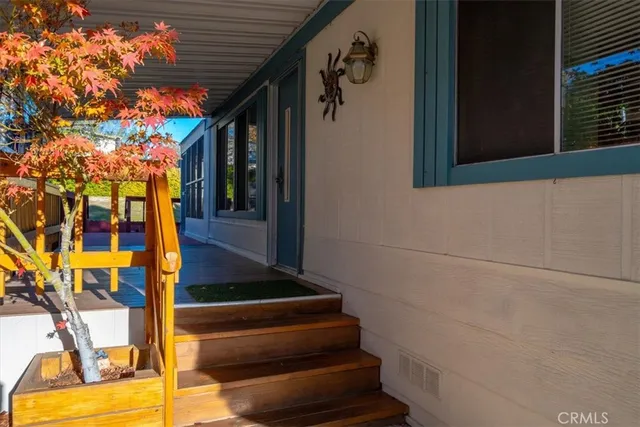a view of a porch with wooden floor and outdoor space