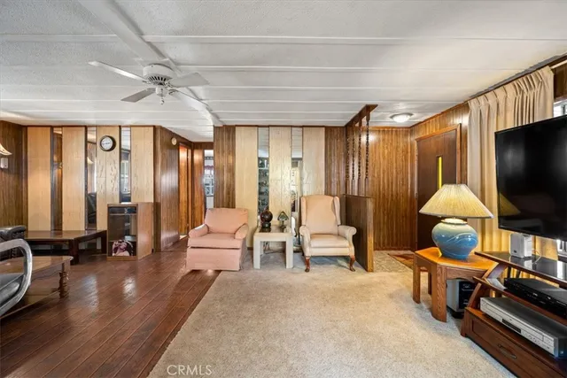a living room with furniture window and wooden floor