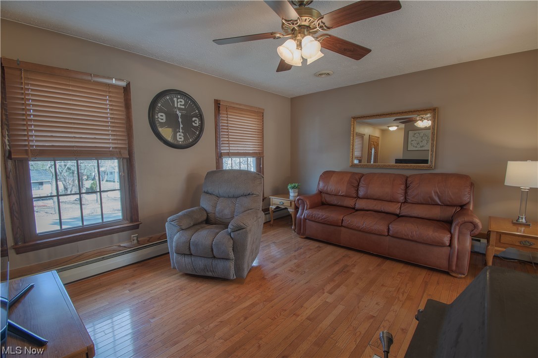 3142 Farmdale Road Akron, OH 44312 - Photo 6 of 22 Welcomed by the great room that features a brick accent wall, a woodburning stove, and an abundance of natural light.