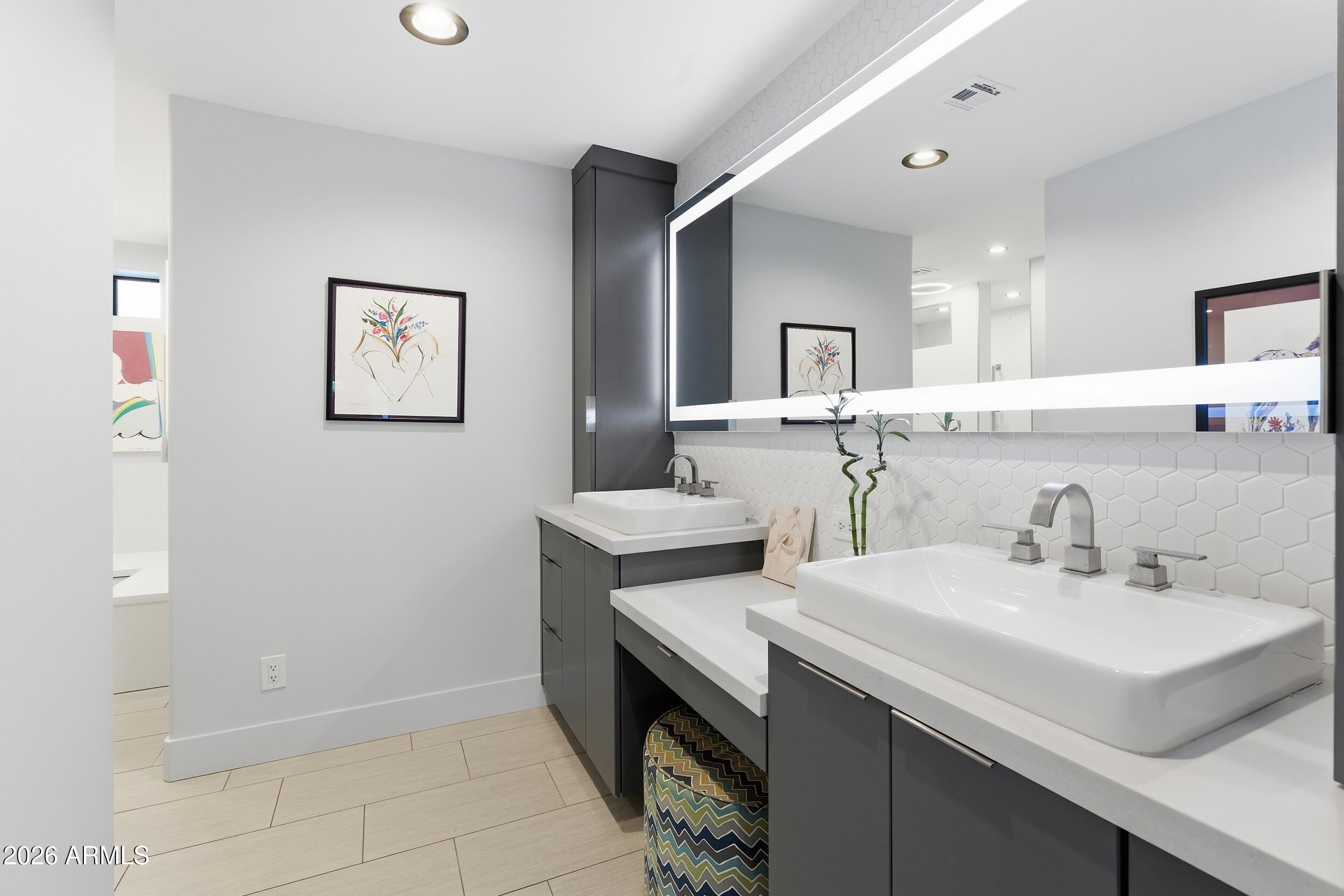 4417 East Mountain View Road Phoenix, AZ 85028 - Photo 23 of 41 a bathroom with a sink and a mirror