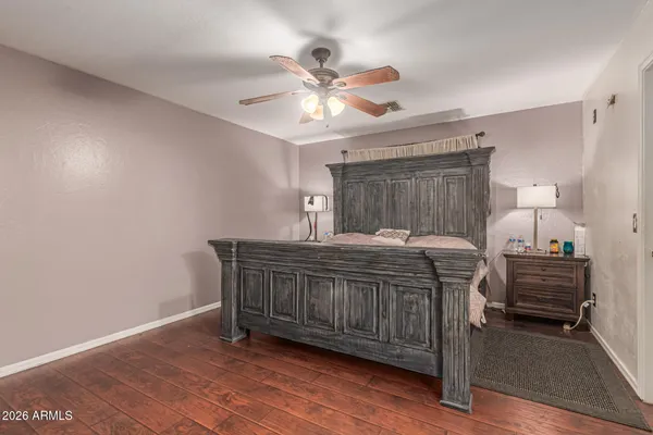 a bed room with a bed and a chandelier