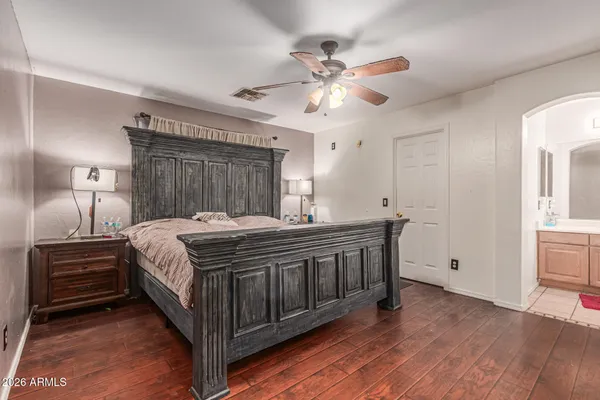 a bed room with a bed and a chandelier