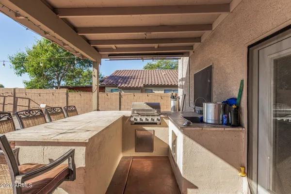 a kitchen with a table chairs and a stove