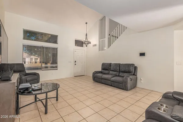 a living room with furniture and a large window