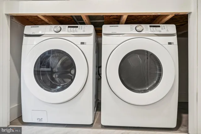 a utility room with dryer and washer