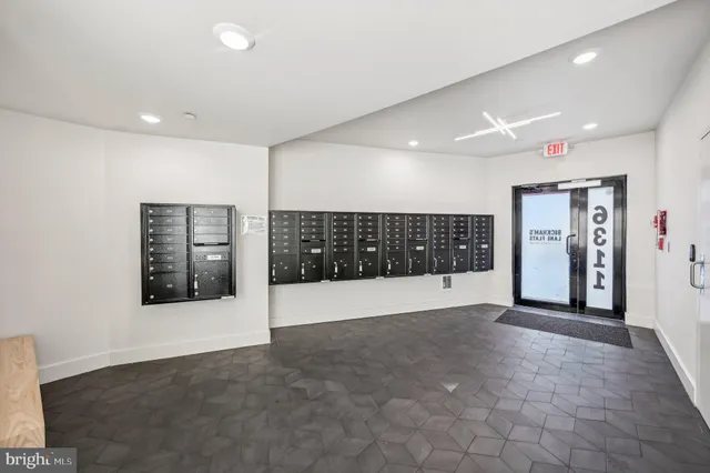 a view of an empty room with closet
