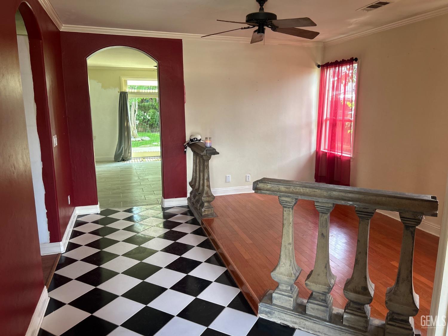 Undisclosed Address Bakersfield, CA 93312 - Photo 7 of 15 a room with black white checkered floor and a chandelier