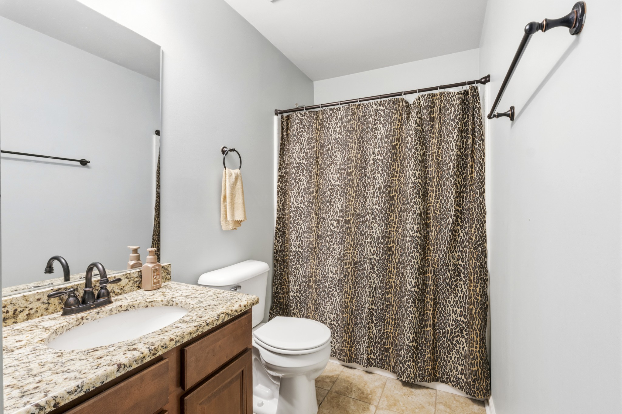 1011 Benwick Road Hendersonville, TN 37075 - Photo 24 of 60 a bathroom with a granite countertop sink toilet and a mirror