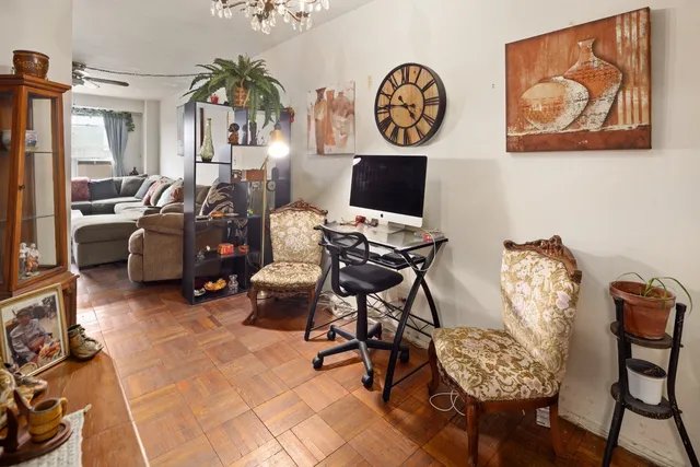 a view of a workspace with furniture and a workspace