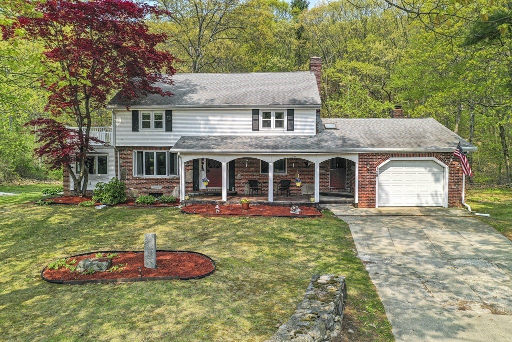 125 Lower Gore Road Webster, MA 01570 - Photo 1 of 42 a front view of a house with yard