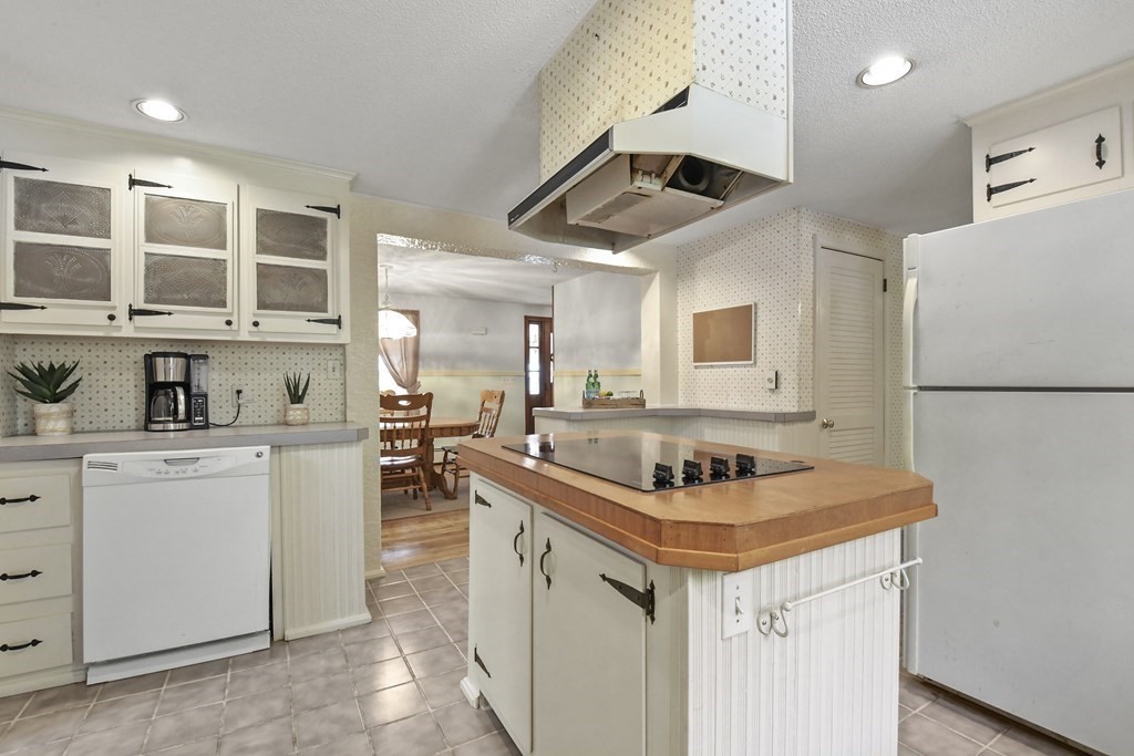 125 Lower Gore Road Webster, MA 01570 - Photo 11 of 42 a kitchen that has a sink a stove and a refrigerator with wooden floor