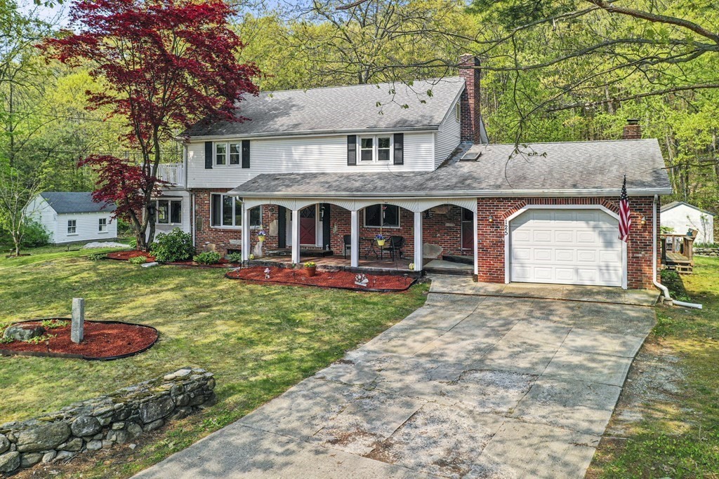 125 Lower Gore Road Webster, MA 01570 - Photo 2 of 42 a front view of a house with yard