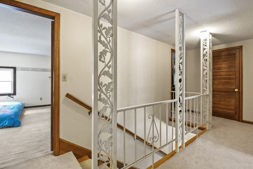 125 Lower Gore Road Webster, MA 01570 - Photo 22 of 42 a view of a hallway with stairs
