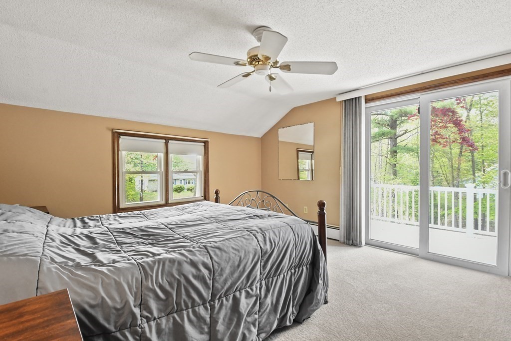 125 Lower Gore Road Webster, MA 01570 - Photo 23 of 42 a bedroom with a bed and a large window