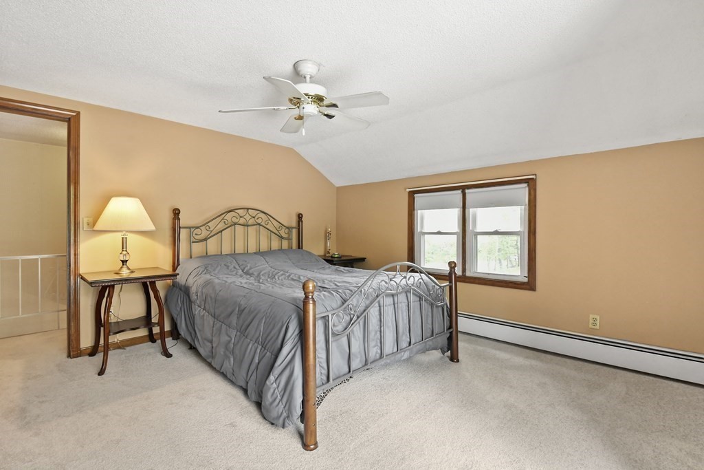 125 Lower Gore Road Webster, MA 01570 - Photo 24 of 42 a bedroom with a bed chair and window
