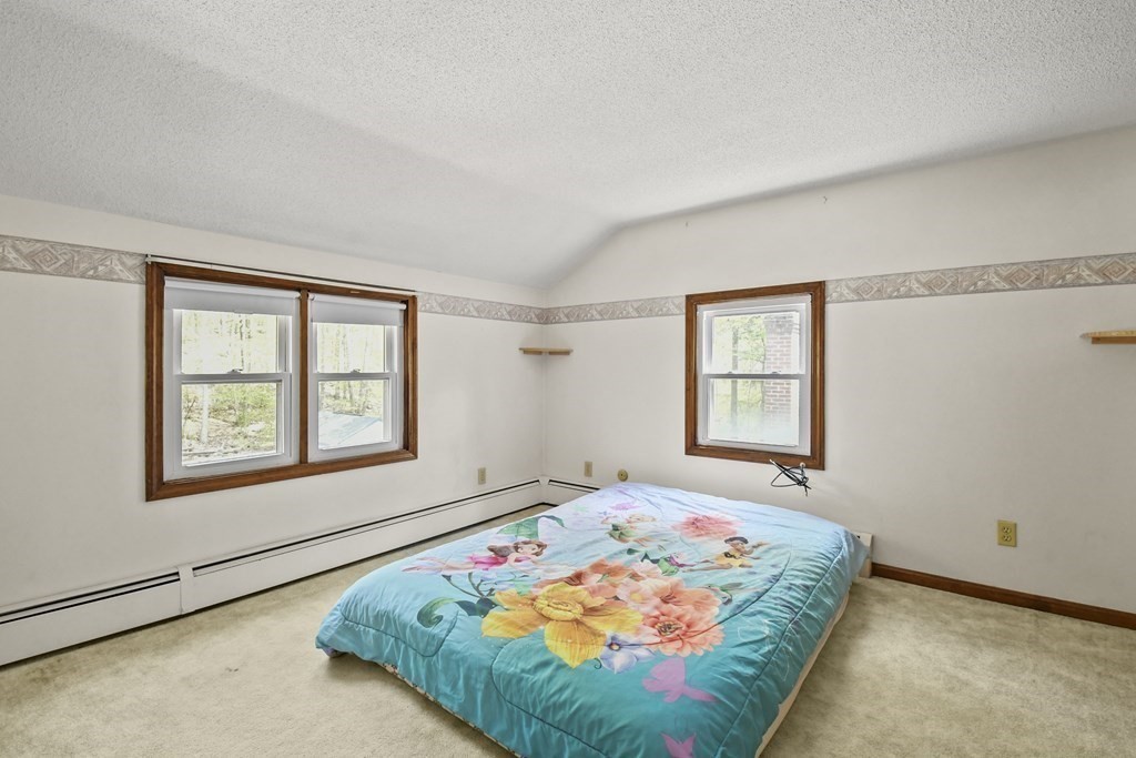 125 Lower Gore Road Webster, MA 01570 - Photo 25 of 42 a bedroom with a bed and a window