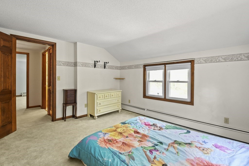 125 Lower Gore Road Webster, MA 01570 - Photo 26 of 42 a bedroom with a bed and a window