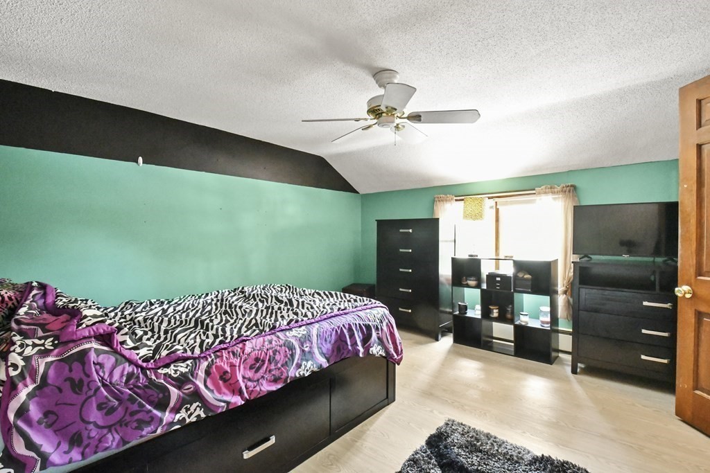 125 Lower Gore Road Webster, MA 01570 - Photo 27 of 42 a bedroom with a large bed and a window
