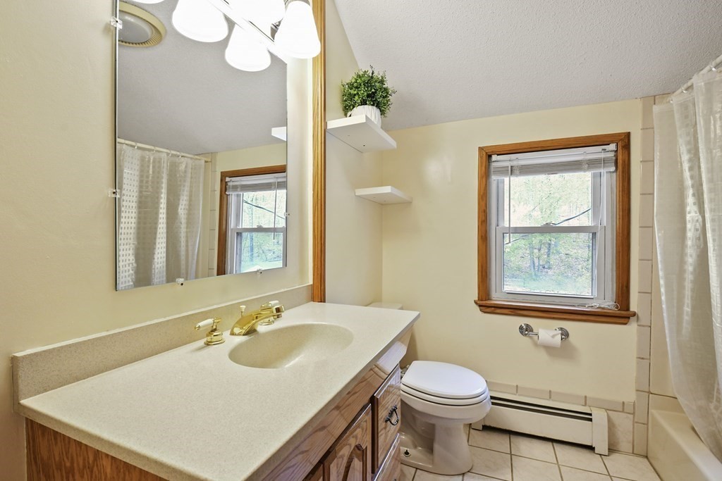 125 Lower Gore Road Webster, MA 01570 - Photo 29 of 42 a bathroom with a sink vanity mirror and toilet