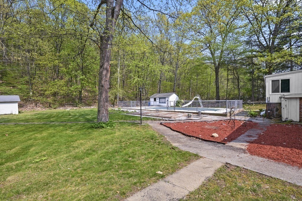 125 Lower Gore Road Webster, MA 01570 - Photo 36 of 42 a view of a backyard with swimming pool