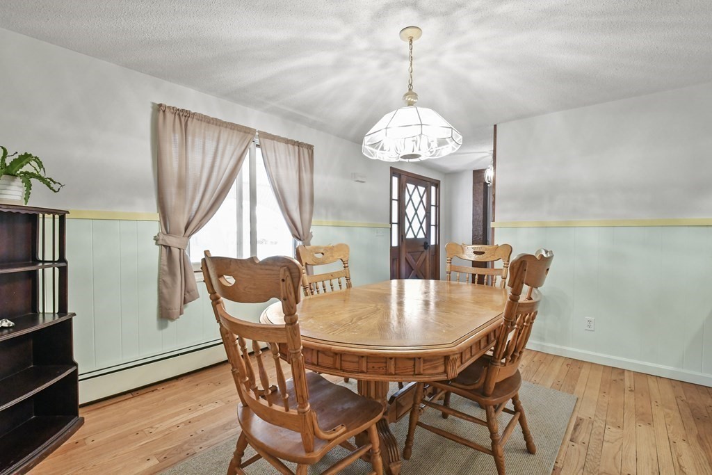 125 Lower Gore Road Webster, MA 01570 - Photo 8 of 42 a view of a dining room with furniture window and wooden floor