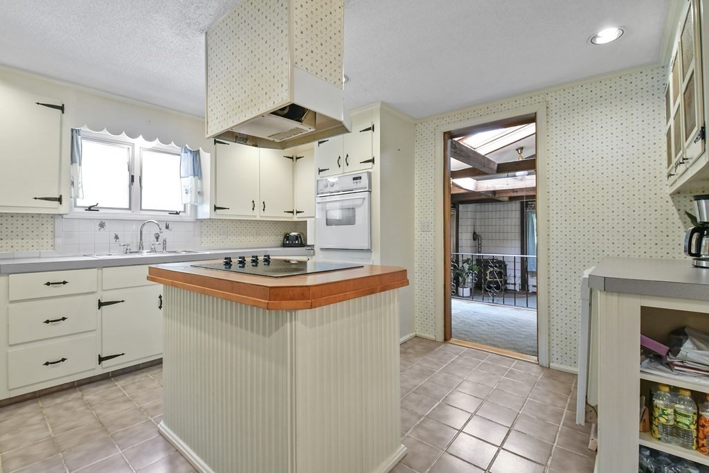125 Lower Gore Road Webster, MA 01570 - Photo 10 of 42 a kitchen with stainless steel appliances granite countertop a stove a sink and a refrigerator