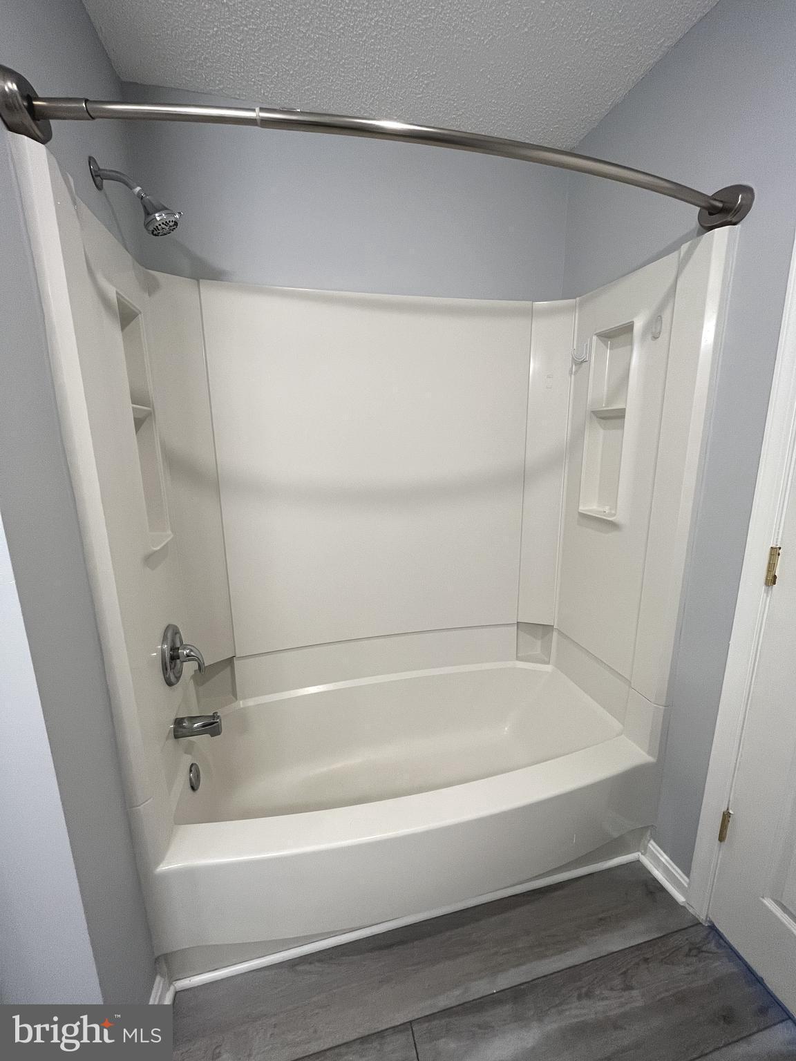 10019 Vanderbilt Circle, Unit 10 Rockville, MD 20850 - Photo 11 of 22 a bathroom with a tub and a shower