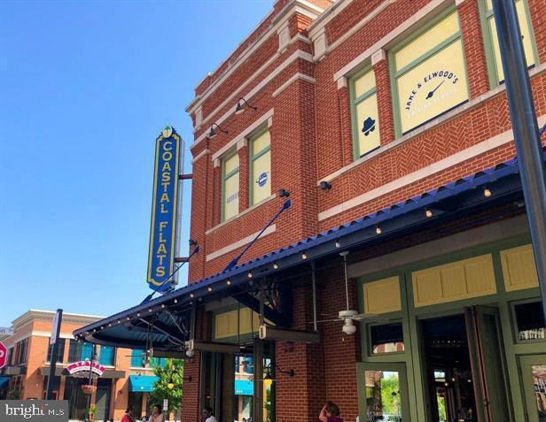10019 Vanderbilt Circle, Unit 10 Rockville, MD 20850 - Photo 21 of 22 a view of a building with a city street