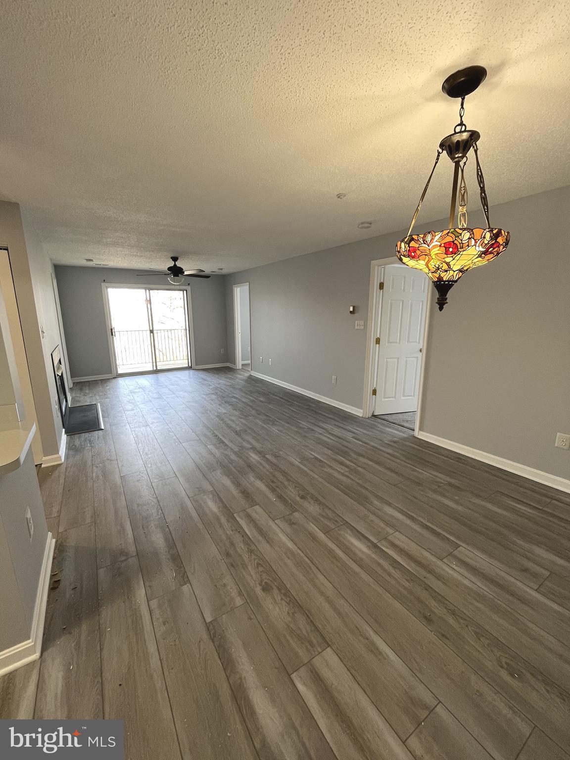 10019 Vanderbilt Circle, Unit 10 Rockville, MD 20850 - Photo 4 of 22 a view of a room with wooden floor and staircase