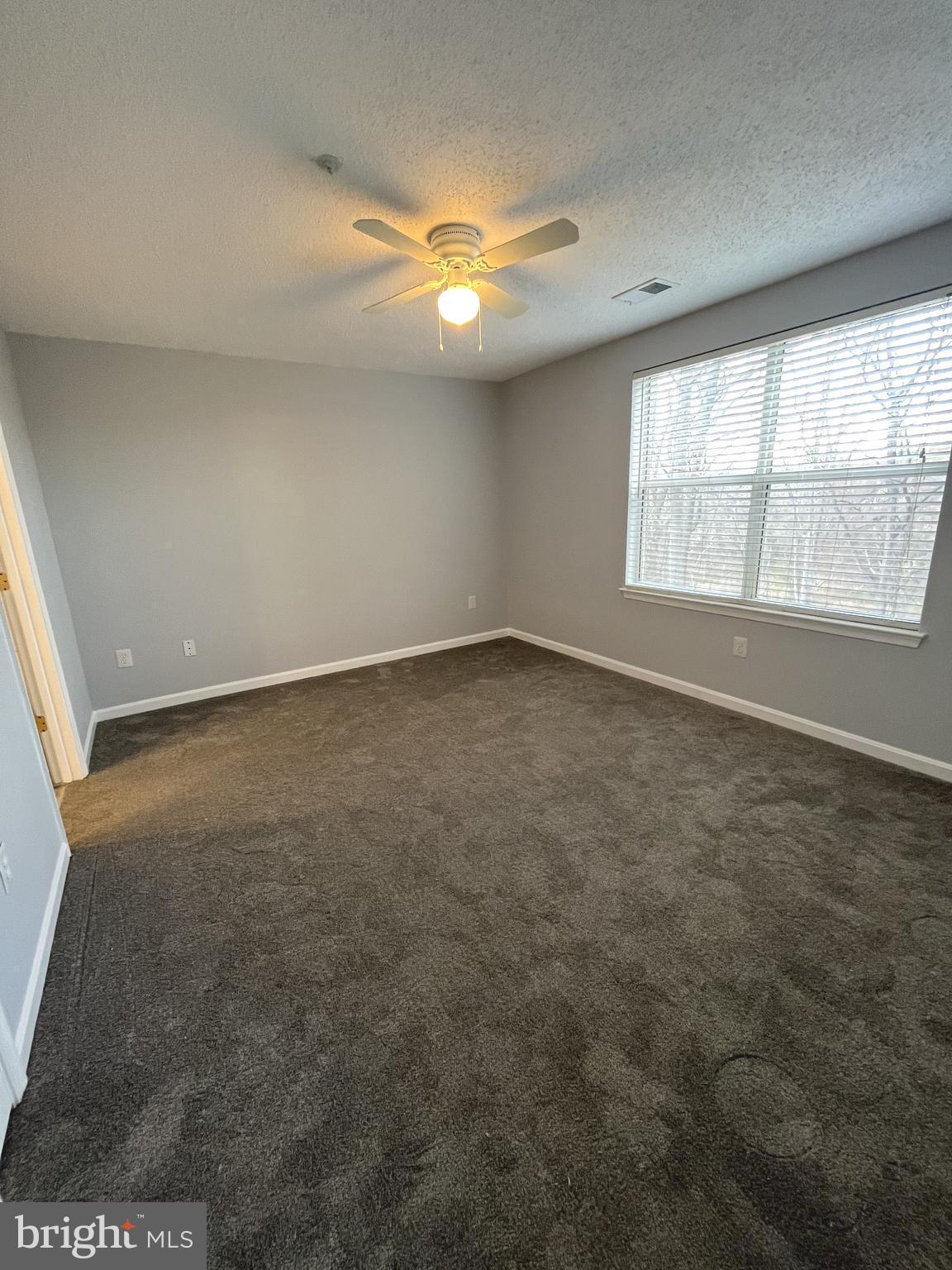 10019 Vanderbilt Circle, Unit 10 Rockville, MD 20850 - Photo 9 of 22 an empty room with a empty space and windows