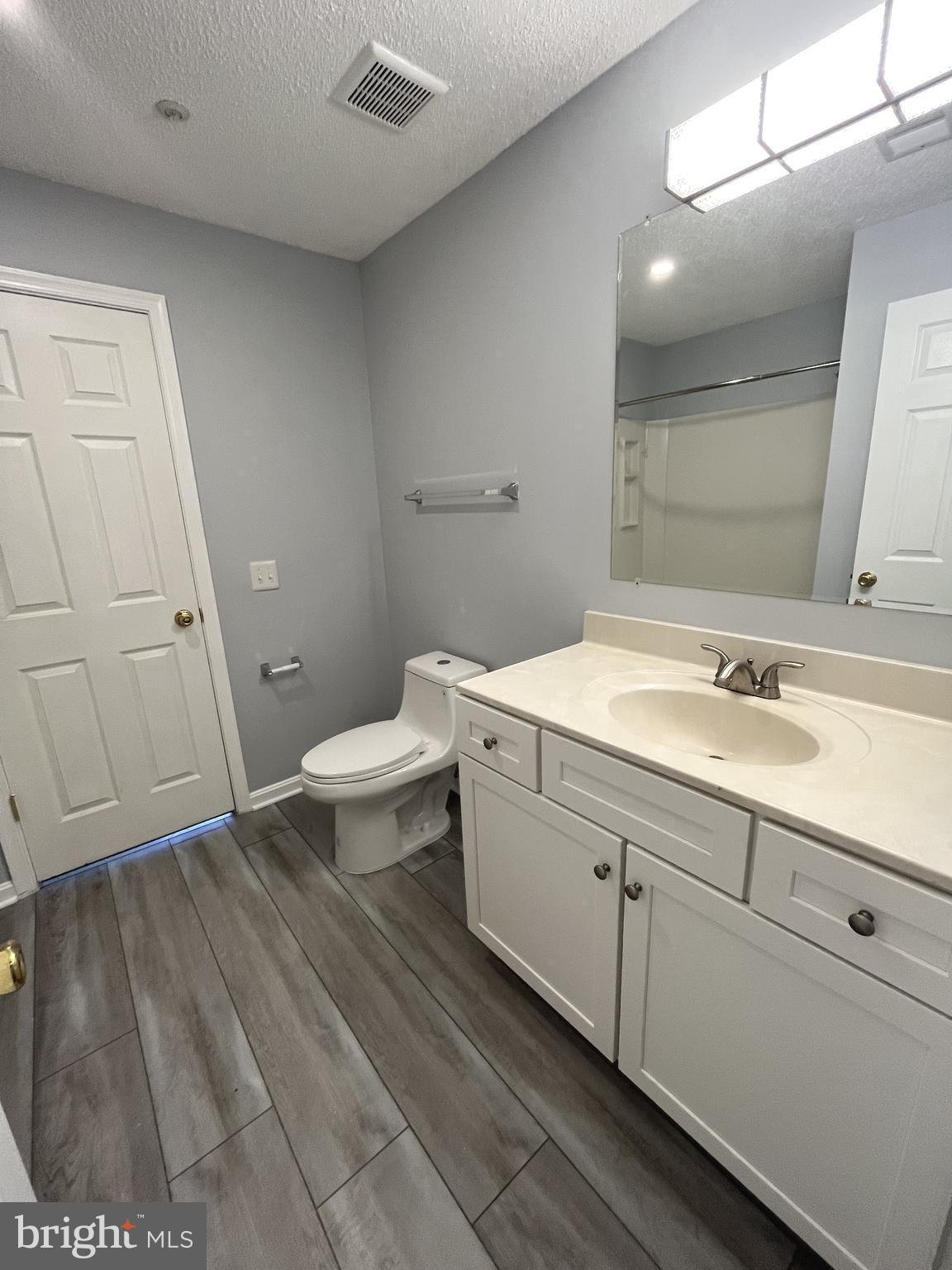 10019 Vanderbilt Circle, Unit 10 Rockville, MD 20850 - Photo 10 of 22 a bathroom with a sink and a toilet