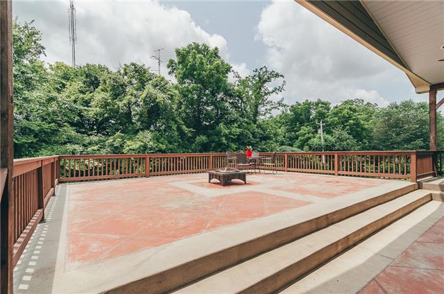 3761 Clarity Road Springfield, TN 37172 - Photo 13 of 20 This patio is a huge plus for this home! Great for entertainment, relaxing by the fire, grilling, & outdoor dining! This patio is partially covered and railings are all cedar and hand built!