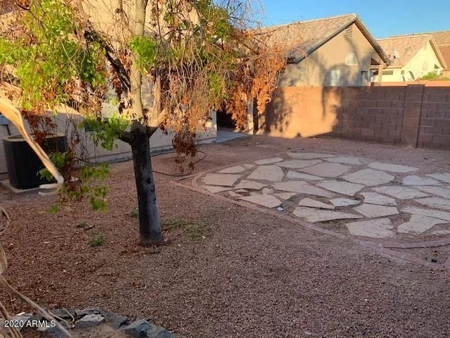a backyard of a house with lots of green space