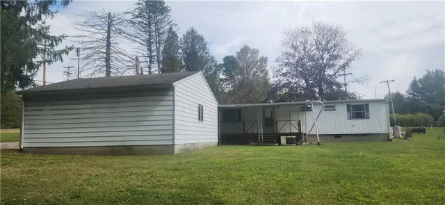 a bathroom with shower and a mirror