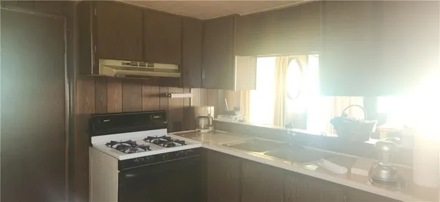 a view of a room with windows and a curtain