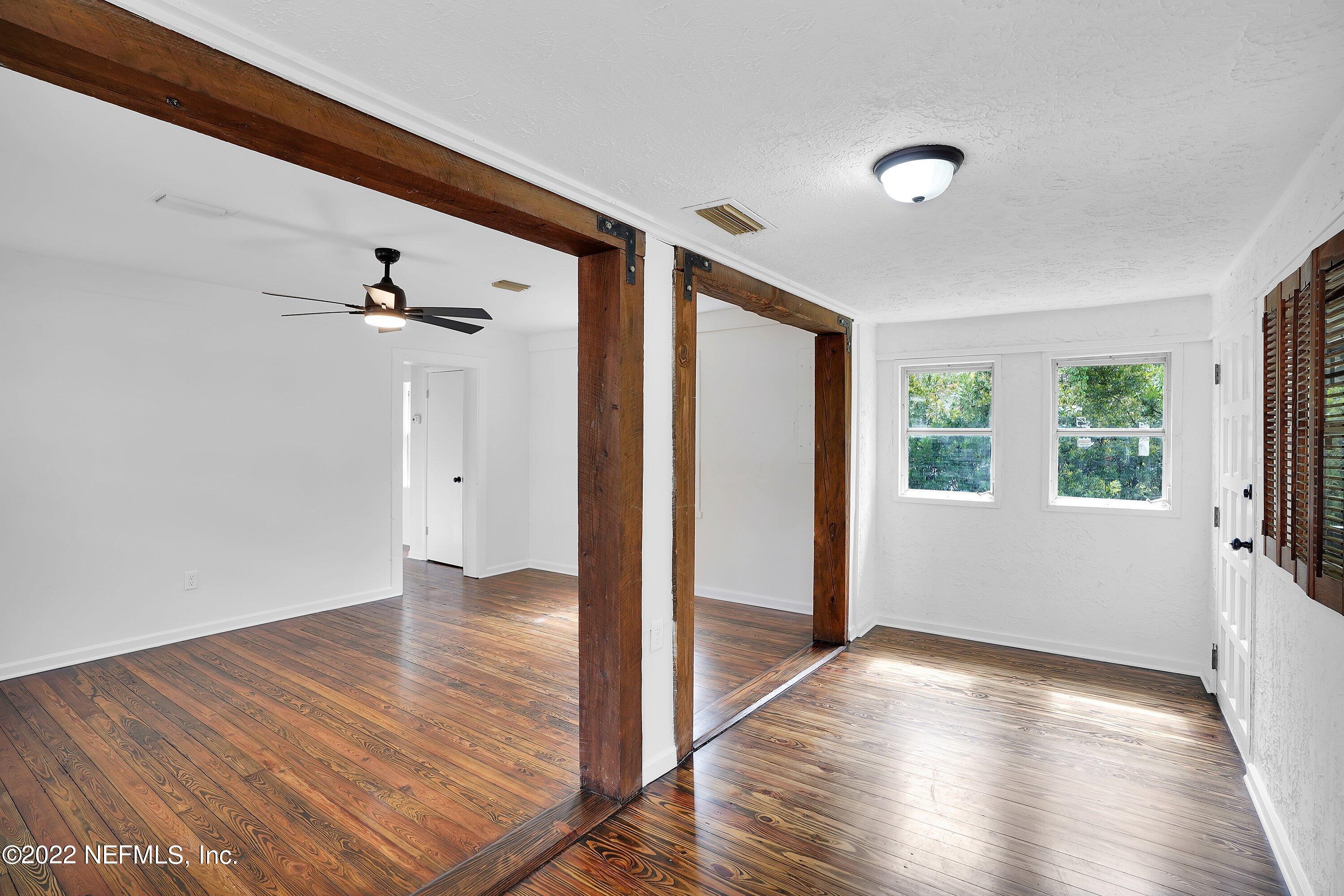 1441 Rensselaer Avenue Jacksonville, FL 32205 - Photo 11 of 35 wooden floor in an empty room with a window