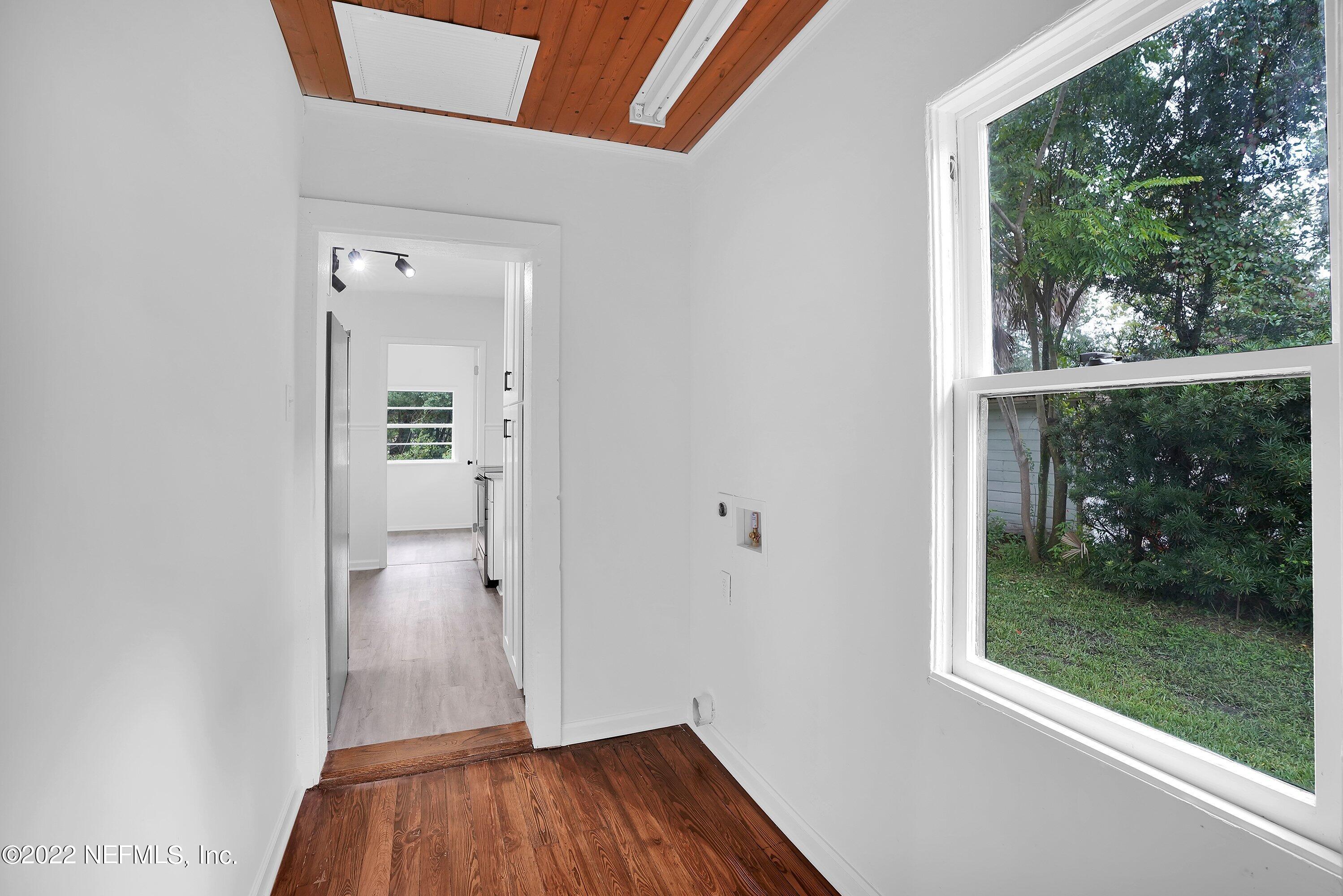 1441 Rensselaer Avenue Jacksonville, FL 32205 - Photo 17 of 35 an empty room with wooden floor and entrance