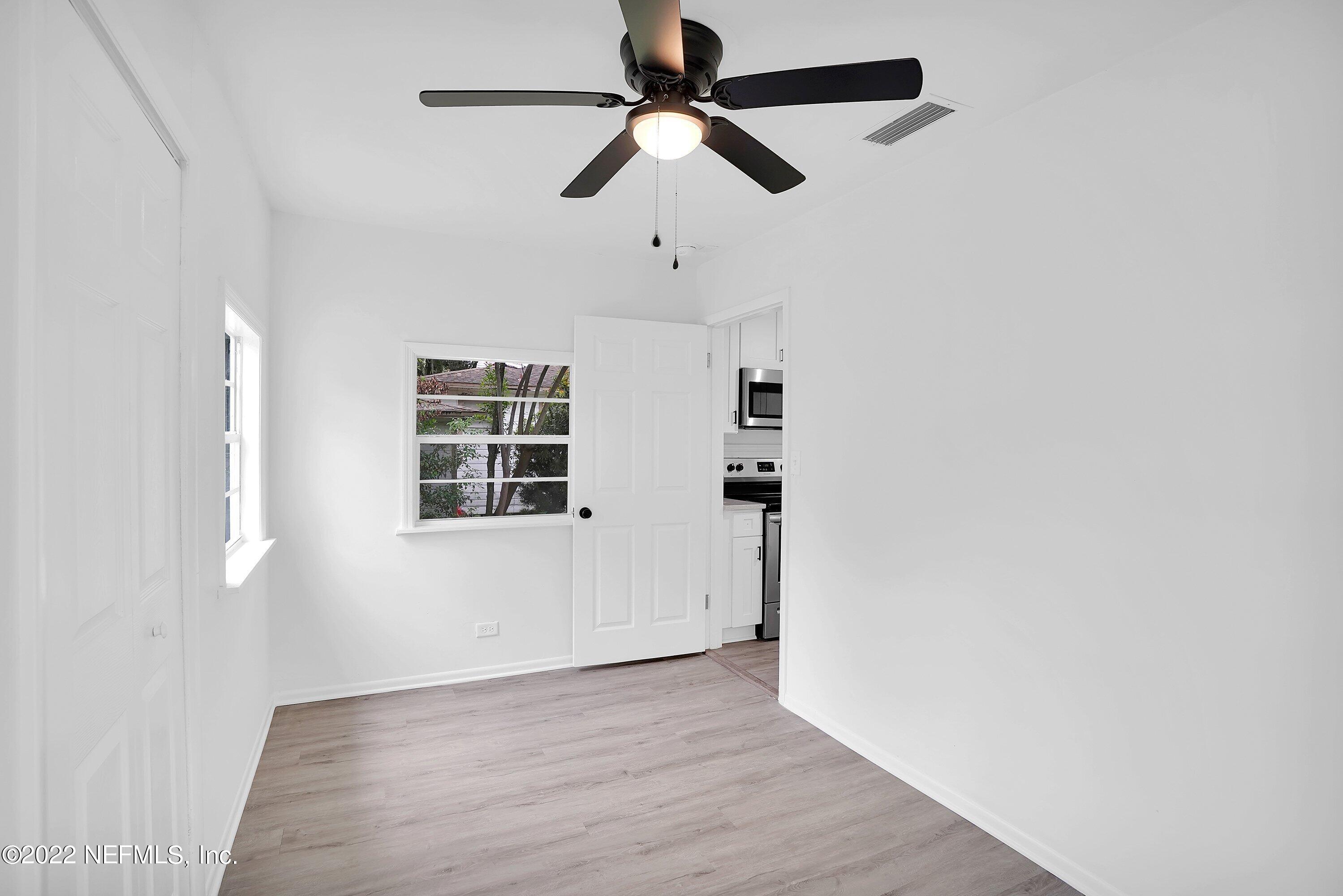 1441 Rensselaer Avenue Jacksonville, FL 32205 - Photo 28 of 35 wooden floor in an empty room with a window
