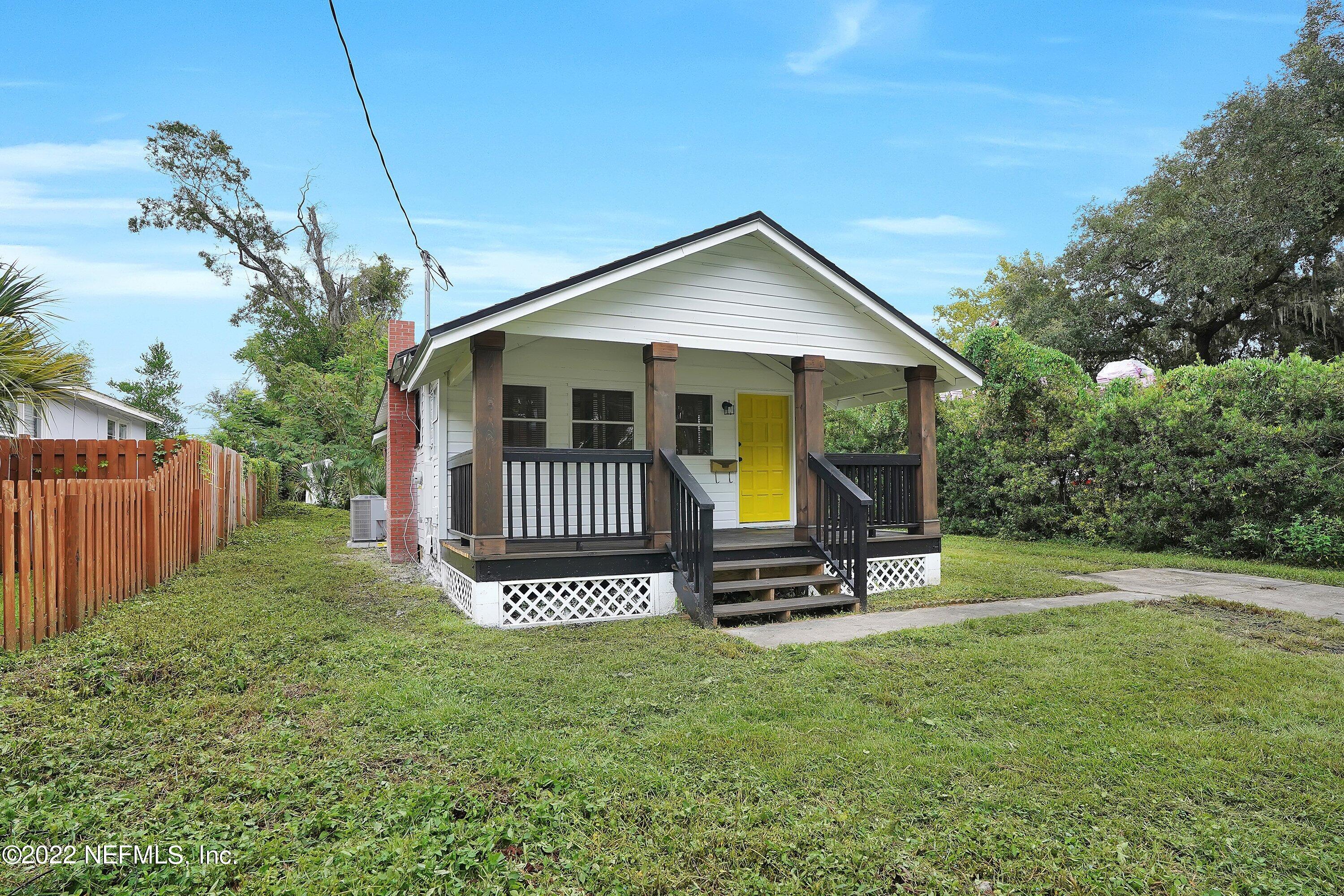 1441 Rensselaer Avenue Jacksonville, FL 32205 - Photo 3 of 35 a view of a house with a small yard and wooden fence