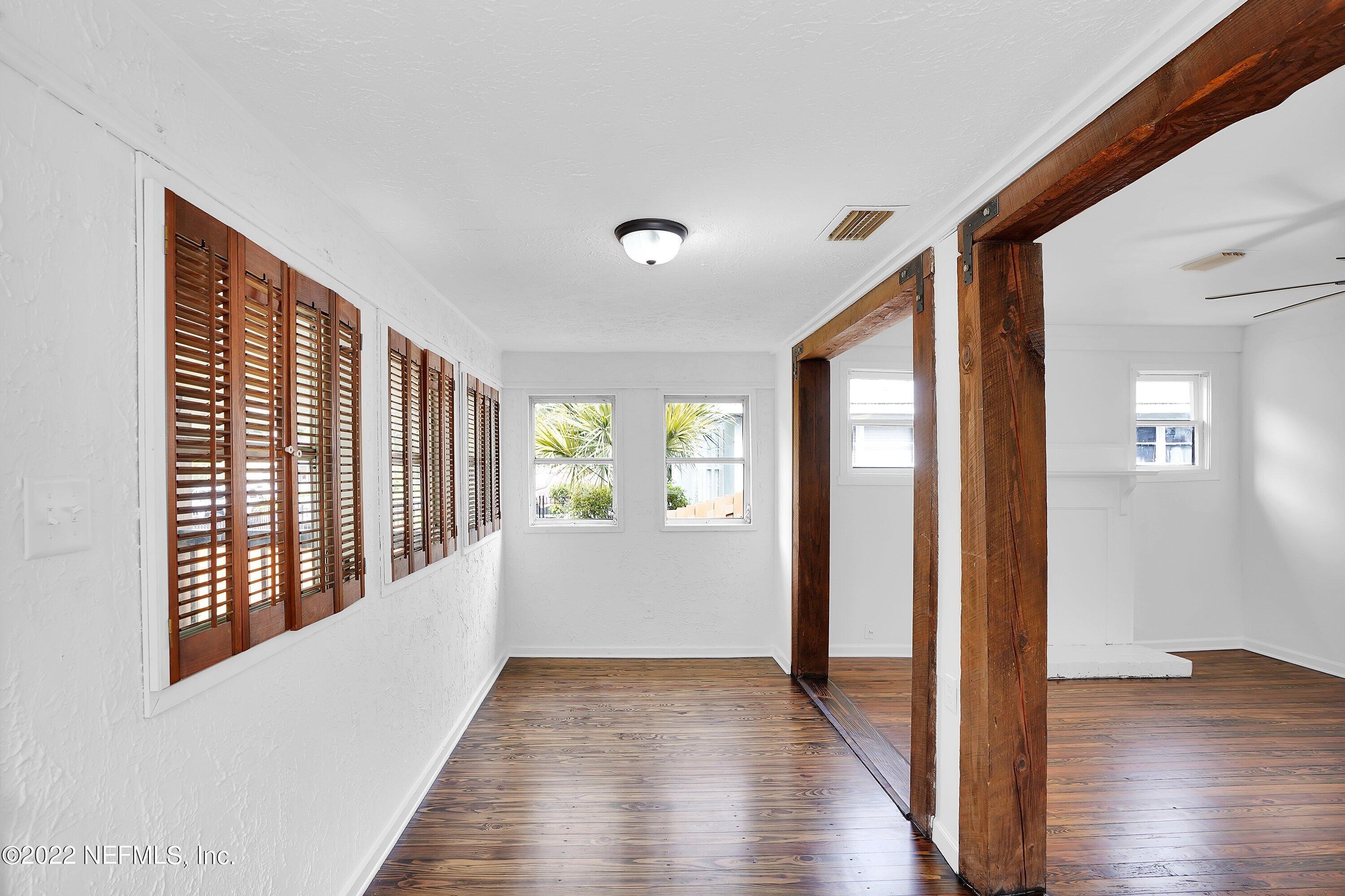 1441 Rensselaer Avenue Jacksonville, FL 32205 - Photo 10 of 35 a view of hallway with wooden floor and stairs
