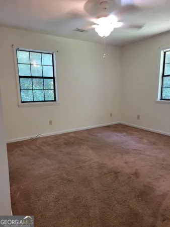 an empty room with windows
