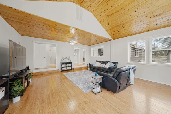 a kitchen with stainless steel appliances granite countertop a refrigerator a stove and a sink