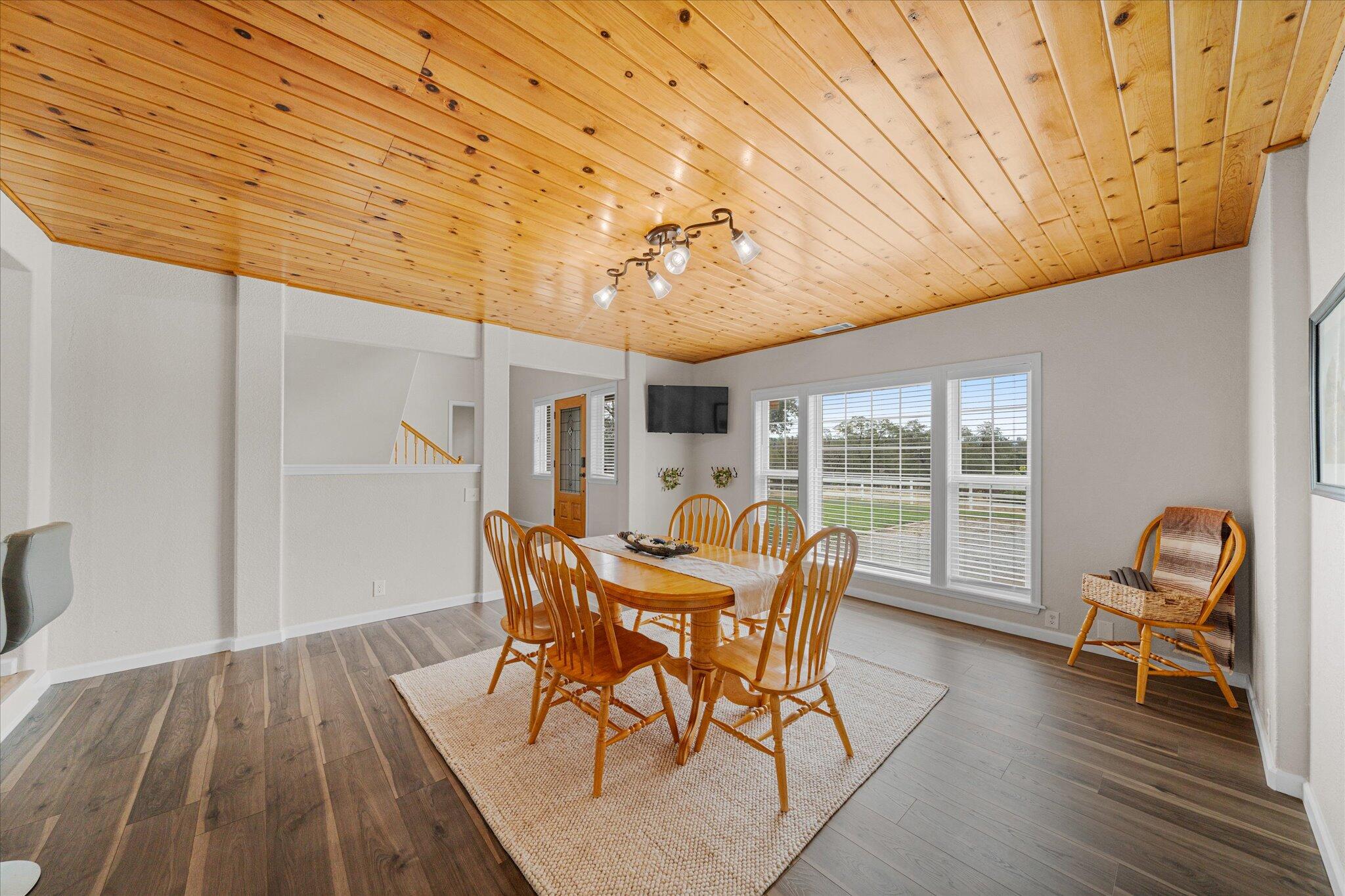 10190 Oak Run Road Oak Run, CA 96069 - Photo 22 of 81 a view of a dining room with furniture and wooden floor
